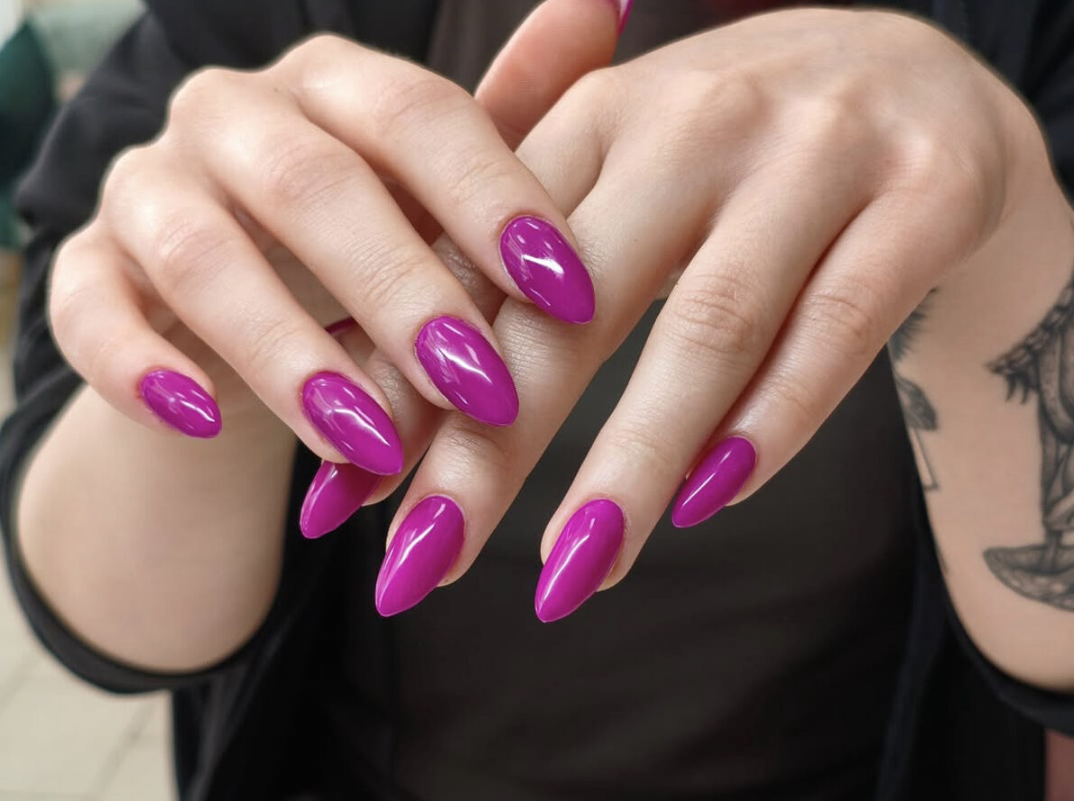 Glossy magenta fuchsia almond gel manicure