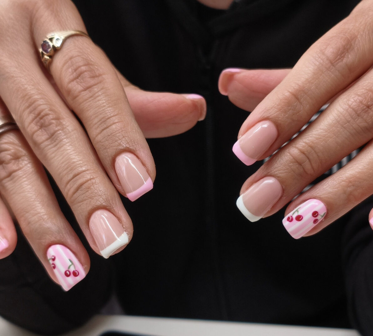 Pink and white French manicure with hand-painted cherry nail art